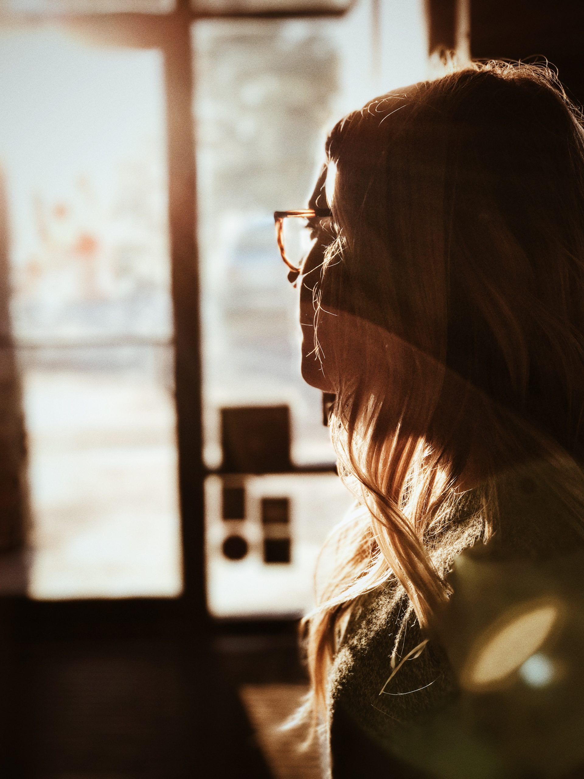 Woman thinking by window